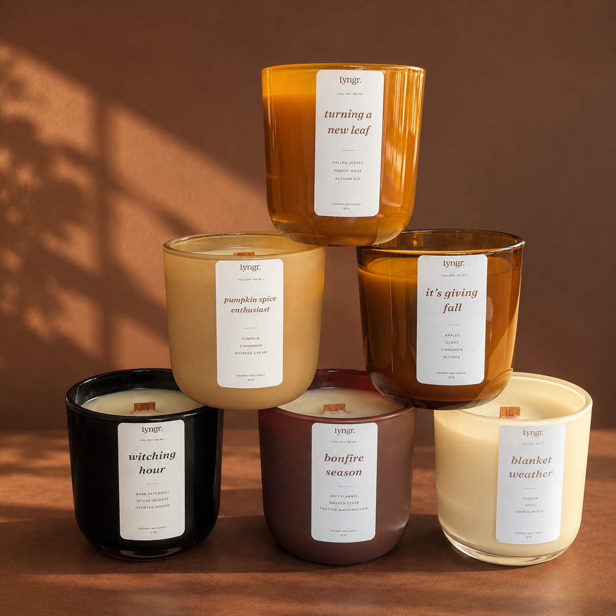 LYNGR Fall Edit seasonal fall candle collection in assorted amber, cream, and brown vessels.